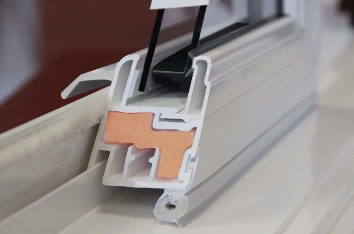Cross-section of an OKNA vinyl window sash showing the multi-chamber frame
