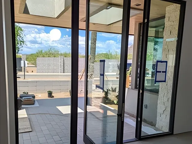Modern glass patio doors with outdoor view installed by HomeTrust