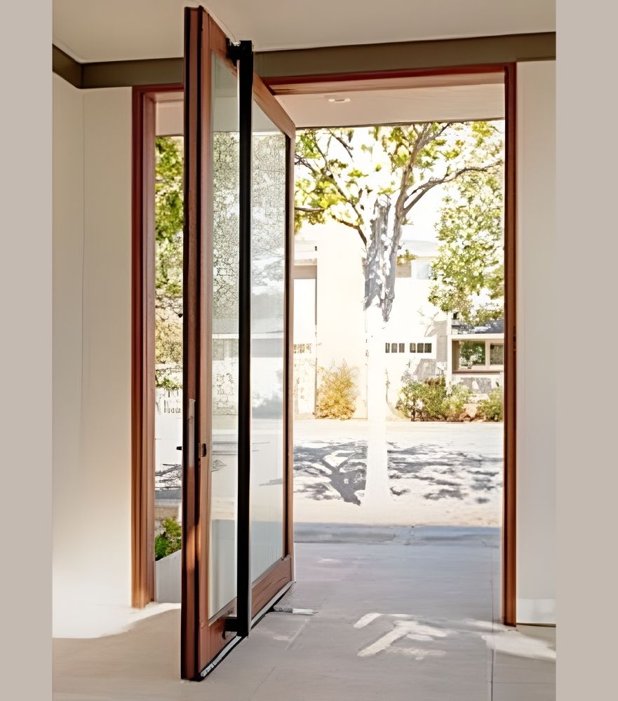 Elegant wood pivot door open outdoors